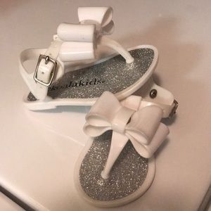 White sandals with bow